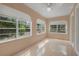 Living room with light-colored walls, tile floors, and natural light at 216 Earl St, Daytona Beach, FL 32118