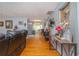 Open-concept living room featuring hardwood floors and decorative ceiling and view to kitchen at 220 Buena Vista St, Debary, FL 32713