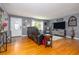 Living room with hardwood floors, gray walls and a large window to let natural light in at 220 Buena Vista St, Debary, FL 32713