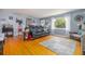 Comfortable living room features hardwood floors, gray walls and an area rug at 220 Buena Vista St, Debary, FL 32713