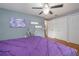 Spacious bedroom featuring hardwood floors, neutral walls, ceiling fan and artwork; designed for comfortable living at 220 Buena Vista St, Debary, FL 32713