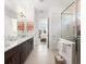 Elegant bathroom featuring a double vanity, granite countertop, modern fixtures, and a glass-enclosed shower at 225 Mosaic Blvd, Daytona Beach, FL 32124