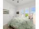 Comfortable bedroom with window view and neutral tones at 225 Mosaic Blvd, Daytona Beach, FL 32124