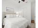 Bright bedroom featuring a comfortable bed, stylish decor, and ceiling fan at 225 Mosaic Blvd, Daytona Beach, FL 32124