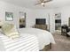 Bright and spacious bedroom featuring large bed, neutral decor, and a ceiling fan at 225 Mosaic Blvd, Daytona Beach, FL 32124