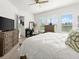 Spacious bedroom featuring a large bed, natural light from the windows, and ample storage at 225 Mosaic Blvd, Daytona Beach, FL 32124