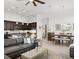 Open-concept layout showcases the kitchen, dining area, and living room, with hardwood floors and modern decor at 225 Mosaic Blvd, Daytona Beach, FL 32124
