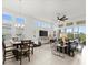 Spacious open-concept design with living, dining, and kitchen areas filled with natural light and stylish decor at 225 Mosaic Blvd, Daytona Beach, FL 32124