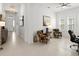 Inviting living room with bright, neutral decor, comfortable seating, and large windows for ample sunlight at 225 Mosaic Blvd, Daytona Beach, FL 32124