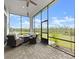 Relaxing screened patio with comfortable seating and view at 225 Mosaic Blvd, Daytona Beach, FL 32124