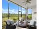 Screened patio with seating area and natural landscape views at 225 Mosaic Blvd, Daytona Beach, FL 32124