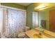 Bathroom featuring a shower with a tub and stylish decorative shower curtain at 2333 Fern Palm Dr, Edgewater, FL 32141