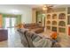 The spacious living room features tiled floors and built-in shelving, perfect for storage at 2333 Fern Palm Dr, Edgewater, FL 32141