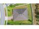 Aerial view of the property highlighting the roof, brick driveway, and expansive, fenced yard at 2337 Oxmoor Dr, Deland, FL 32724