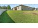 Expansive backyard with lush green grass and partial fence; perfect for outdoor activities and relaxation at 2337 Oxmoor Dr, Deland, FL 32724