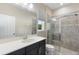 Bathroom features a tiled glass shower, window, commode, and modern vanity with chrome faucet at 2337 Oxmoor Dr, Deland, FL 32724