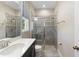 Bathroom features a tiled glass shower, window, commode, and modern vanity with chrome faucet at 2337 Oxmoor Dr, Deland, FL 32724