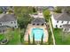 Aerial view of community pool, surrounded by lounge chairs and manicured landscaping at 2337 Oxmoor Dr, Deland, FL 32724