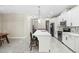 Bright kitchen showcases white cabinets, stainless steel appliances, a large island with seating, and an open floor plan at 2337 Oxmoor Dr, Deland, FL 32724