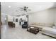 Inviting living room in an open-concept home features modern furniture, a ceiling fan, and stylish decor at 2337 Oxmoor Dr, Deland, FL 32724