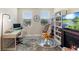 Inviting living room featuring large windows, modern decor, and ample natural light for a cozy atmosphere at 2337 Oxmoor Dr, Deland, FL 32724