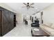 Open-concept living space with a kitchen island, living room seating, and a view of the entryway at 2337 Oxmoor Dr, Deland, FL 32724