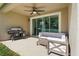 Covered patio with a ceiling fan and outdoor furniture at 2337 Oxmoor Dr, Deland, FL 32724