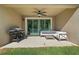 Covered patio with a ceiling fan and outdoor furniture at 2337 Oxmoor Dr, Deland, FL 32724
