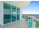 Wide balcony with views of the water, pool, and lush greenery; perfect for relaxation and entertaining at 241 Riverside Dr # 902, Holly Hill, FL 32117