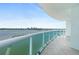 Spacious balcony with glass railings, offering panoramic waterfront views and city skyline at 241 Riverside Dr # 902, Holly Hill, FL 32117