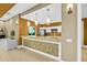 A well-appointed bar area featuring mosaic tile accents, modern pendant lights, and stainless steel appliances at 241 Riverside Dr # 902, Holly Hill, FL 32117