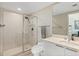 Elegant bathroom featuring a glass-enclosed shower, modern fixtures, and a stylish vanity with neutral color palette at 241 Riverside Dr # 902, Holly Hill, FL 32117