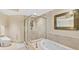 Spa-like bathroom featuring a glass shower, soaking tub, and elegant fixtures at 241 Riverside Dr # 902, Holly Hill, FL 32117