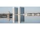Scenic view of waterfront condos, reflecting on the water, with a gazebo in the foreground at 241 Riverside Dr # 902, Holly Hill, FL 32117