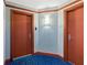 Well-lit hallway with multiple doors and modern carpeting creates a polished first impression of the building at 241 Riverside Dr # 902, Holly Hill, FL 32117