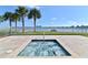 Inviting hot tub with views of the water and palm trees provides a serene escape from everyday life at the building at 241 Riverside Dr # 902, Holly Hill, FL 32117
