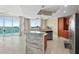 Bright, open kitchen design with stainless steel appliances and breakfast bar overlooking scenic views at 241 Riverside Dr # 902, Holly Hill, FL 32117