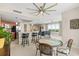 Bright living space featuring an open kitchen, dining area, and comfortable seating with great natural light at 241 Riverside Dr # 902, Holly Hill, FL 32117