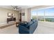 Cozy living room featuring stylish furniture, neutral tones, and a beautiful view of the water at 241 Riverside Dr # 902, Holly Hill, FL 32117
