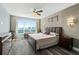 Serene main bedroom with waterfront views, hardwood floors, and contemporary decor at 241 Riverside Dr # 902, Holly Hill, FL 32117