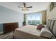 Bright main bedroom with large windows overlooking the ocean and light blue accent wall at 241 Riverside Dr # 902, Holly Hill, FL 32117
