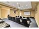 Private theater room with comfortable seating, projector, and screen for an immersive movie experience at 241 Riverside Dr # 902, Holly Hill, FL 32117