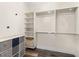 Spacious walk-in closet featuring custom shelving, hanging rods, and modern storage solutions at 241 Riverside Dr # 902, Holly Hill, FL 32117