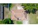 An aerial view of the house shows the roof, driveway, lawn and surrounding trees at 242 Linda Vista St, Debary, FL 32713