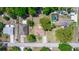 Spacious backyard featuring a pool, lawn, and mature trees offering shade and privacy at 242 Linda Vista St, Debary, FL 32713