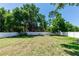 Expansive backyard enclosed with a white vinyl fence offering lots of space and privacy at 242 Linda Vista St, Debary, FL 32713