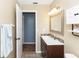 Clean bathroom featuring stylish vanity with dark wood cabinets at 242 Linda Vista St, Debary, FL 32713