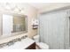 Clean bathroom featuring stylish vanity with mosaic tile backsplash and shower with tub at 242 Linda Vista St, Debary, FL 32713