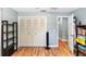 Bedroom with wood floors and a large closet at 242 Linda Vista St, Debary, FL 32713