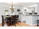 Spacious dining room with wood floors adjacent to the renovated kitchen, great for entertaining at 242 Linda Vista St, Debary, FL 32713